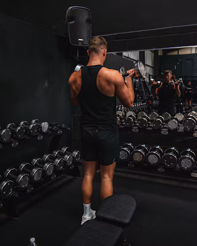 Athlete training with dumbbells